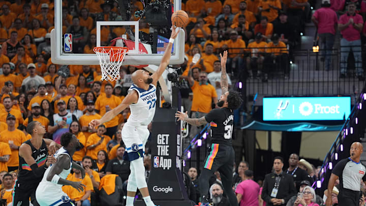 May 4, 2026; San Antonio, Texas, USA; Minnesota Timberwolves center Rudy Gobert (27) blocks a shot by San Antonio Spurs forward Julian Champagnie (30) in the first half during game one of the second round of the 2026 NBA Playoffs at Frost Bank Center. Mandatory Credit: Daniel Dunn-Imagn Images