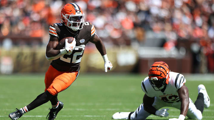 Sep 7, 2025; Cleveland, Ohio, USA; Cleveland Browns running back Dylan Sampson (22) runs against Cincinnati Bengals linebacker Oren Burks (42) during the first half at Huntington Bank Field. Mandatory Credit: Scott Galvin-Imagn Images