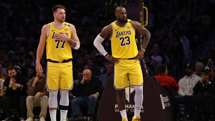 Feb 27, 2025; Los Angeles, California, USA; Los Angeles Lakers guard Luka Doncic (77) and forward LeBron James (23) during the second quarter against the Minnesota Timberwolves at Crypto.com Arena. Mandatory Credit: Jason Parkhurst-Imagn Images
