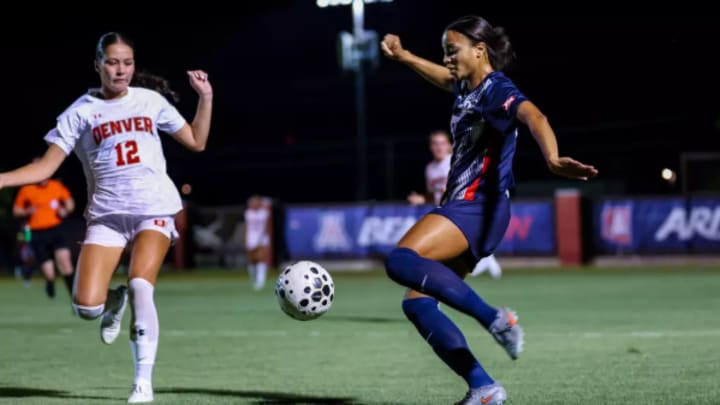 Narissa Fults kicks past a Denver defender.
