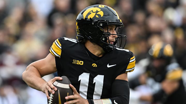 Oct 25, 2025; Iowa City, Iowa, USA; Iowa Hawkeyes quarterback Mark Gronowski (11) runs with the ball during the first quarter against the Minnesota Golden Gophers at Kinnick Stadium. Mandatory Credit: Jeffrey Becker-Imagn Images
