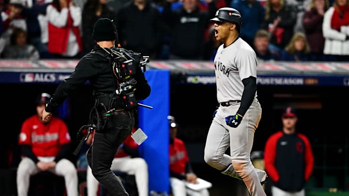 Oct 19, 2024; Cleveland, Ohio, USA; New York Yankees outfielder Juan Soto (22) crosses home plate after hitting a three run home run during the tenth inning against the Cleveland Guardians during game five of the ALCS for the 2024 MLB playoffs at Progressive Field.
