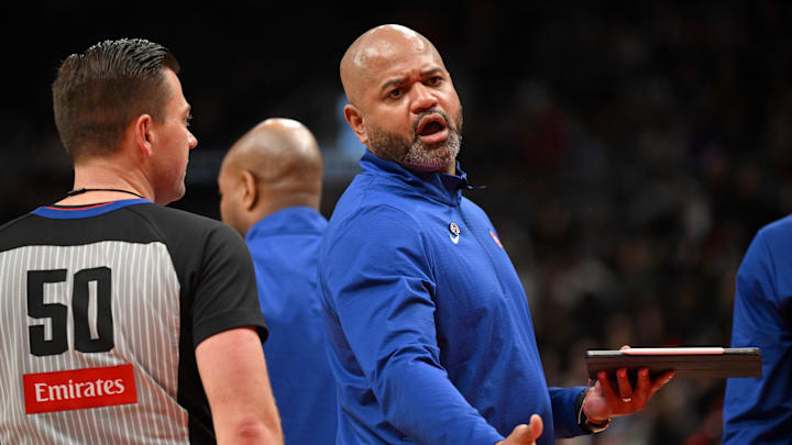 Apr 4, 2025; Toronto, Ontario, CAN;  Detroit Pistons head coach J.B. Bickerstaff speaks to game official Gediminas Petraitis (50) during a time out against the Toronto Raptors in the second half at Scotiabank Arena. Mandatory Credit: Dan Hamilton-Imagn Images