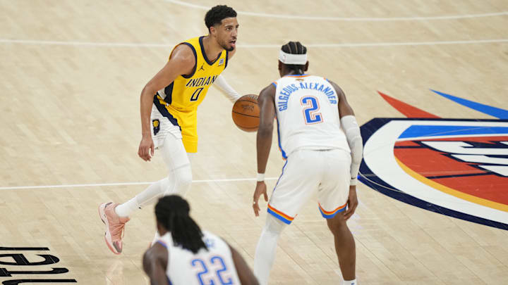 Jun 5, 2025; Oklahoma City, Oklahoma, USA; Indiana Pacers guard Tyrese Haliburton (0) dribbles the ball against Oklahoma City Thunder guard Shai Gilgeous-Alexander (2) during the third quarter in game one of the 2025 NBA Finals at Paycom Center. Mandatory Credit: Kyle Terada-Imagn Images[]'