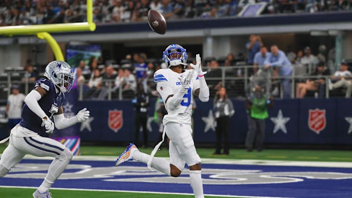 Detroit Lions wide receiver Jameson Williams catches a touchdown against the Dallas Cowboys.