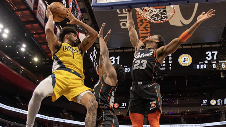 Mar 20, 2024; Detroit, Michigan, USA; Indiana Pacers forward Obi Toppin (1) grabs the rebound next to Detroit Pistons guard Marcus Sasser (25) and guard Jaden Ivey (23) in the first half at Little Caesars Arena. Mandatory Credit: David Reginek-Imagn Images Mar 20, 2024; Detroit, Michigan, USA; Indiana Pacers forward Obi Toppin (1) grabs the rebound next to Detroit Pistons guard Marcus Sasser (25) and guard Jaden Ivey (23) in the first half at Little Caesars Arena. Mandatory Credit: David Reginek-Imagn Images