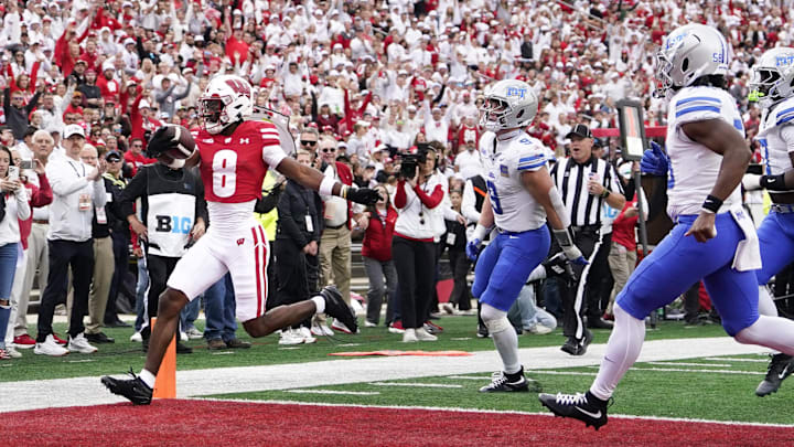Sep 6, 2025; Madison, Wisconsin, USA;  Wisconsin Badgers wide receiver Vinny Anthony II (8) scores against the Middle Tennessee Blue Raiders during the second half at Camp Randall Stadium.