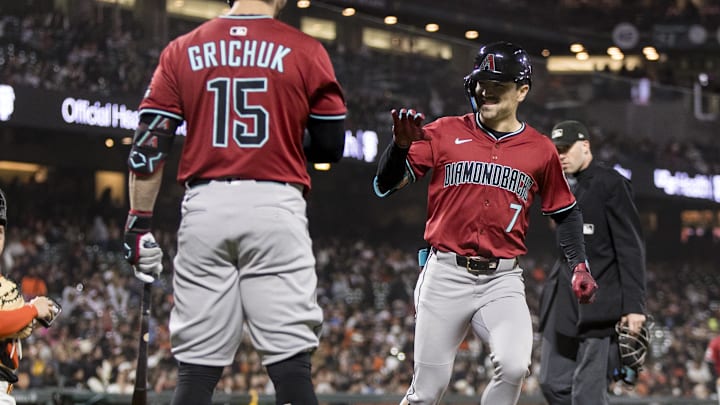 May 13, 2025; San Francisco, California, USA; Arizona Diamondbacks right fielder Corbin Carroll (7) is congratulated by designated hitter Randal Grichuk (15) after he hit a solo home run against the San Francisco Giants during the seventh inning at Oracle Park. Mandatory Credit: John Hefti-Imagn Images