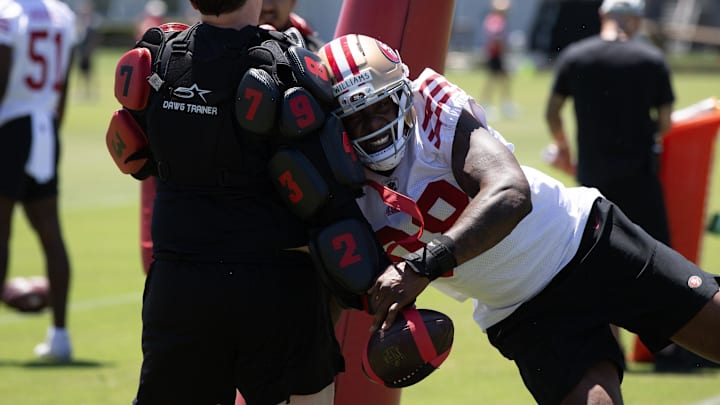 May 9, 2025; Santa Clara, CA, USA; San Francisco 49ers defensive lineman Mykel Williams (98) bats at a ball as part of a rushing drill during the teamís rookie minicamp. Mandatory Credit: D. Ross Cameron-Imagn Images