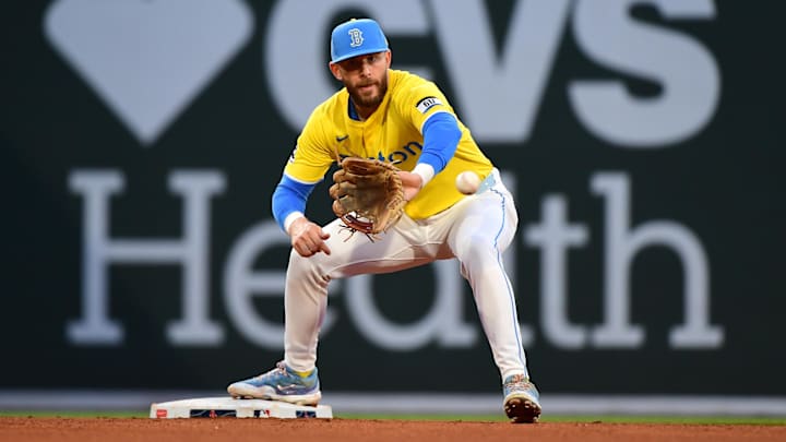 May 24, 2025; Boston, Massachusetts, USA;  Boston Red Sox shortstop Trevor Story (10) fields the ball to start a double play during the sixth inning against the Baltimore Orioles at Fenway Park. Mandatory Credit: Bob DeChiara-Imagn Images
