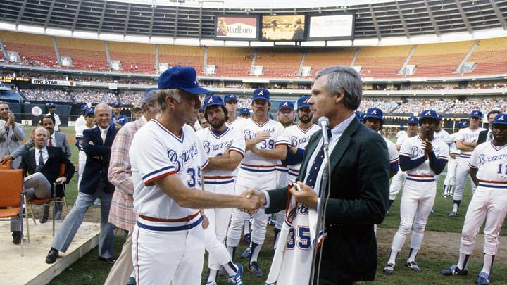 Unknown Date; Atlanta, GA, USA; FILE PHOTO; Atlanta Braves pitcher Phil Niekro (35) at a ceremony with owner Ted Turner (right) at Fulton County Stadium. Mandatory Credit: Manny Rubio-Imagn Images