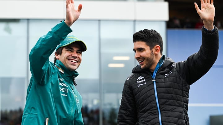 Jun 9, 2024; Montreal, Quebec, CAN; Aston Martin driver Lance Stroll (CAN) (left) and BWT Alpine driver Esteban Ocon (FRA) (right) salute the crowd during the drivers parade of the Canadien Grand Prix at Circuit Gilles Villeneuve. Mandatory Credit: David Kirouac-USA TODAY Sports