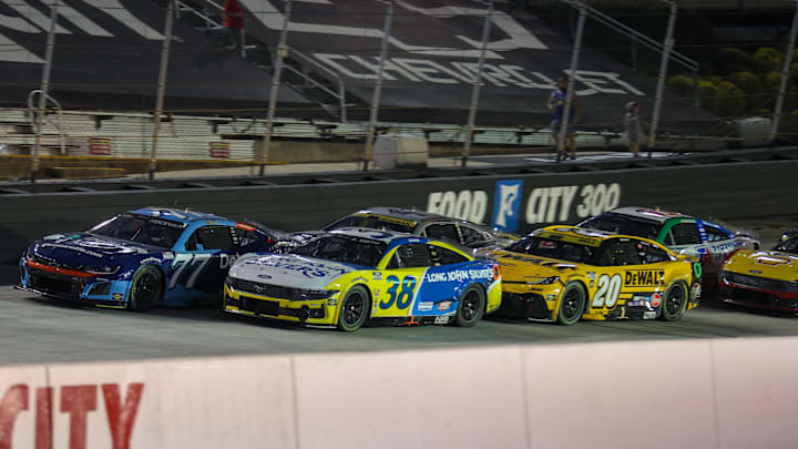 Bristol, Tennessee, USA; NASCAR Cup Series driver Carson Hocevar (77) and driver Zane Smith (38) lead driver Alex Bowman (48) and driver Christopher Bell (20) at Bristol Motor Speedway. Bristol, Tennessee, USA; NASCAR Cup Series driver Carson Hocevar (77) and driver Zane Smith (38) lead driver Alex Bowman (48) and driver Christopher Bell (20) at Bristol Motor Speedway.