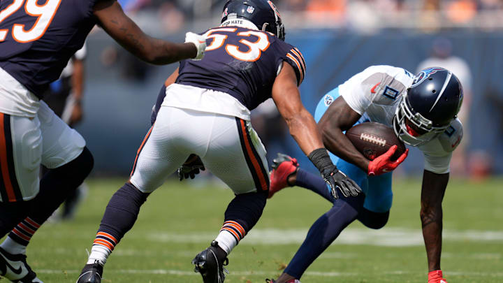 Tennessee Titans wide receiver Calvin Ridley (0) looks to run after a catch against Chicago Bears linebacker T.J. Edwards (53) at Soldier Field in Chicago, Ill., Sunday, Sept. 8, 2024.