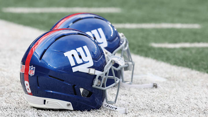 Aug 16, 2025; East Rutherford, New Jersey, USA; New York Giants helmets rest on the field before the preseason game against the New York Jets at MetLife Stadium. Mandatory Credit: Vincent Carchietta-Imagn Images