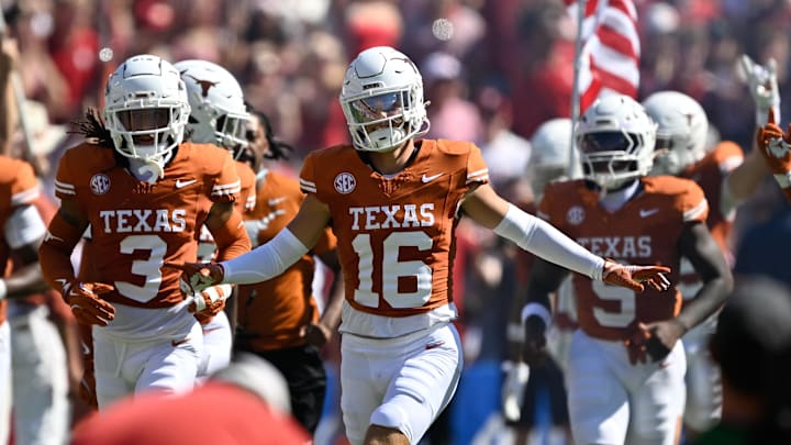 Texas Longhorns defensive back Michael Taaffe leads the team on to the field against the Oklahoma Sooners at the Cotton Bowl.