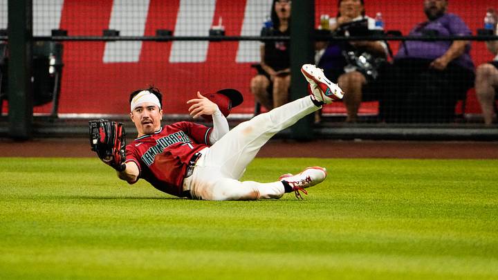 Jun 7, 2026; Phoenix, Arizona, USA; Arizona Diamondbacks right fielder Corbin Carroll (7) makes a sliding catch in the outfield during the ninth inning at Chase Field against the Washington Nationals against the Washington Nationals. Mandatory Credit: Arianna Grainey-Imagn Images Jun 7, 2026; Phoenix, Arizona, USA; Arizona Diamondbacks right fielder Corbin Carroll (7) makes a sliding catch in the outfield during the ninth inning at Chase Field against the Washington Nationals against the Washington Nationals. Mandatory Credit: Arianna Grainey-Imagn Images