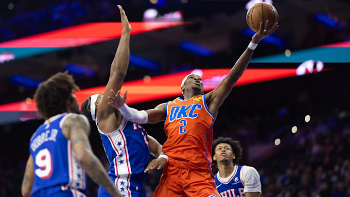 Jan 14, 2025; Philadelphia, Pennsylvania, USA; Oklahoma City Thunder guard Shai Gilgeous-Alexander (2) drives for a shot past Philadelphia 76ers forward Guerschon Yabusele (28) during the third quarter at Wells Fargo Center. Mandatory Credit: Bill Streicher-Imagn Images