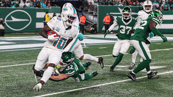 Miami Dolphins wide receiver Tyreek Hill (10) is tackled by New York Jets running back Isaiah Davis (32) during a punt return during the first half at MetLife Stadium. Miami Dolphins wide receiver Tyreek Hill (10) is tackled by New York Jets running back Isaiah Davis (32) during a punt return during the first half at MetLife Stadium.