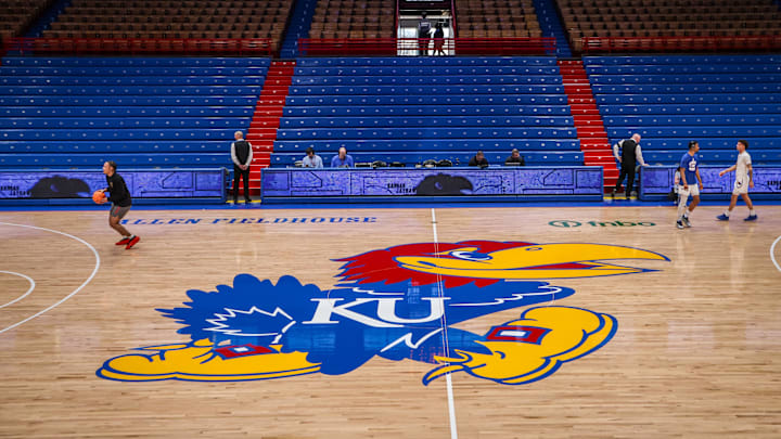 Mar 1, 2025; Lawrence, Kansas, USA; Kansas Jayhawks logo at center court prior to the game against the Texas Tech Red Raiders at Allen Fieldhouse. Mandatory Credit: William Purnell-Imagn Images Mar 1, 2025; Lawrence, Kansas, USA; Kansas Jayhawks logo at center court prior to the game against the Texas Tech Red Raiders at Allen Fieldhouse. Mandatory Credit: William Purnell-Imagn Images