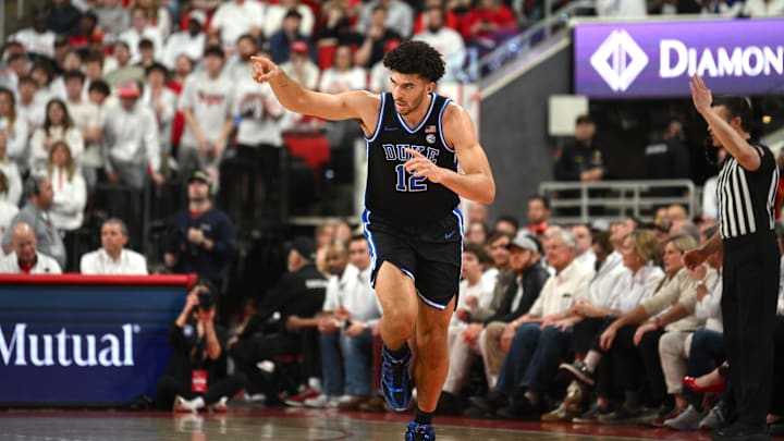 Mar 2, 2026; Raleigh, North Carolina, USA; Duke Blue Devils forward Cameron Boozer (12) reacts after scoring against the NC State Wolfpack during the first half at Lenovo Center. Mandatory Credit: Zachary Taft-Imagn Images Mar 2, 2026; Raleigh, North Carolina, USA; Duke Blue Devils forward Cameron Boozer (12) reacts after scoring against the NC State Wolfpack during the first half at Lenovo Center. Mandatory Credit: Zachary Taft-Imagn Images
