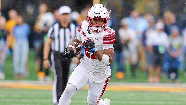 Sep 27, 2025; Morgantown, West Virginia, USA; Utah Utes running back NaQuari Rogers (21) runs the ball during the first quarter against the West Virginia Mountaineers at Milan Puskar Stadium. Mandatory Credit: Ben Queen-Imagn Images