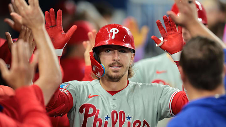 Philadelphia Phillies second baseman Bryson Stott (5) celebrates with teammates after hitting a three-run home run against the Miami Marlins during the seventh inning at loanDepot Park. 