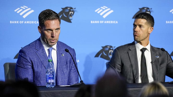 Feb 1, 2024; Charlotte, NC, USA; Carolina Panthers general manager Dan Morgan (left) speaks with new coach Dave Canales during the introductory press conference at Bank of America Stadium. Mandatory Credit: Jim Dedmon-Imagn Images