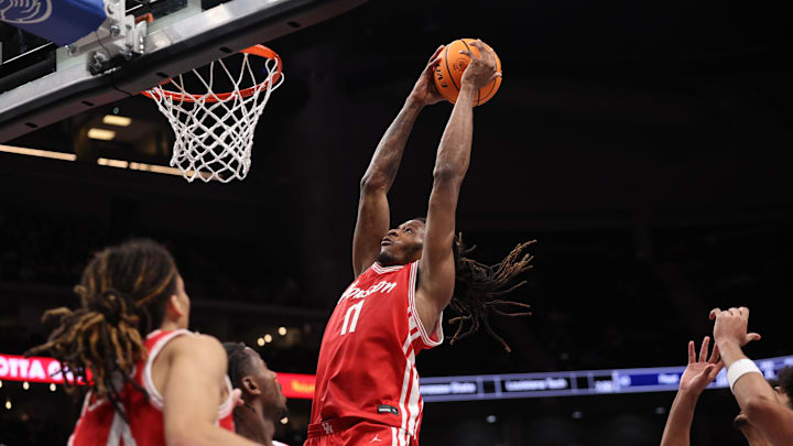 Mar 14, 2026; Kansas City, MO, USA; Houston Cougars forward Joseph Tugler (11) dunks during the second half against the Arizona Wildcats during the men's Big 12 Conference Tournament Championship at T-Mobile Center. Mandatory Credit: William Purnell-Imagn Images