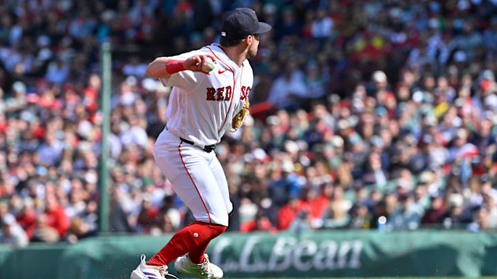 Apr 3, 2026; Boston, Massachusetts, USA; Boston Red Sox third baseman Caleb Durbin (5) throws the ball to first base for an out against the San Diego Padres during the third inning at Fenway Park. Mandatory Credit: Eric Canha-Imagn Images