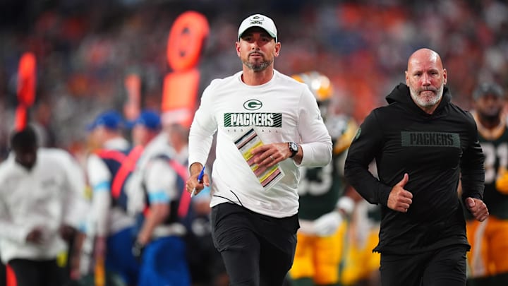 Aug 18, 2024; Denver, Colorado, USA; Green Bay Packers head coach Matt LaFleur leaves the field in the first half against the Denver Broncos at Empower Field at Mile High. Mandatory Credit: Ron Chenoy-Imagn Images