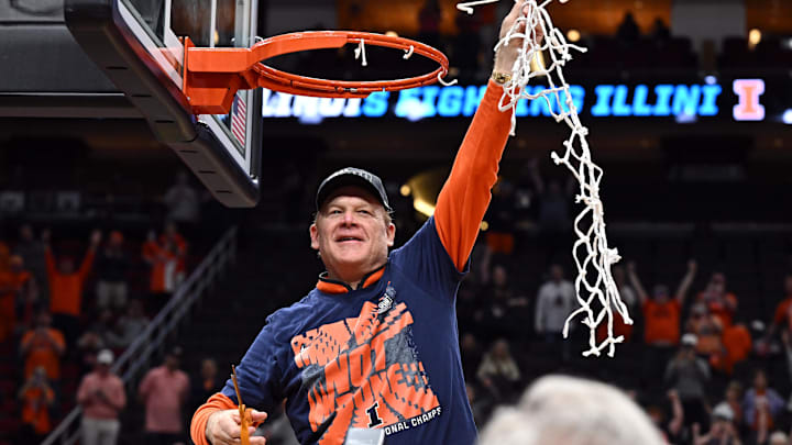 Mar 28, 2026; Houston, TX, USA; Illinois Fighting Illini head coach Brad Underwood celebrates after cutting down the net after defeating the Iowa Hawkeyes in an Elite Eight game of the South Regional of the men's 2026 NCAA Tournament at Toyota Center. Mandatory Credit: Maria Lysaker-Imagn Images