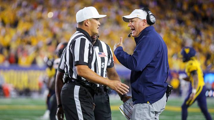 Sep 26, 2026; Morgantown, West Virginia, USA; West Virginia Mountaineers head coach Rich Rodriguez argues a call during the first quarter against the Oklahoma State Cowboys at Milan Puskar Stadium. Mandatory Credit: Ben Queen-Imagn Images Sep 26, 2026; Morgantown, West Virginia, USA; West Virginia Mountaineers head coach Rich Rodriguez argues a call during the first quarter against the Oklahoma State Cowboys at Milan Puskar Stadium. Mandatory Credit: Ben Queen-Imagn Images