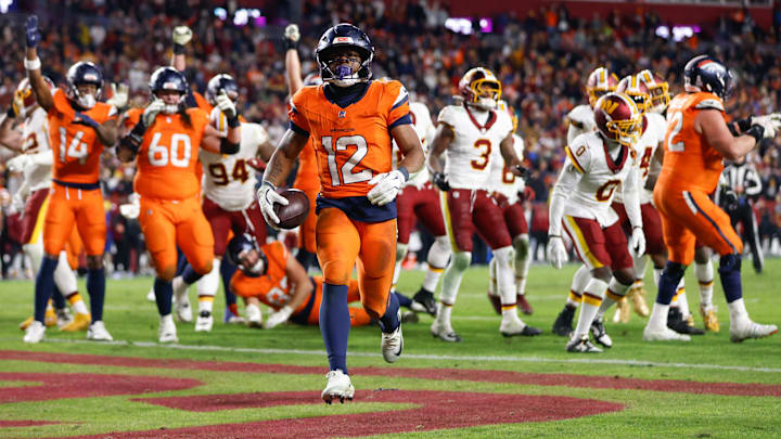 Nov 30, 2025; Landover, Maryland, USA; Denver Broncos running back RJ Harvey (12) celebrates after scoring a touchdown against the Washington Commanders in overtime of the game at Northwest Stadium. Mandatory Credit: Peter Casey-Imagn Images