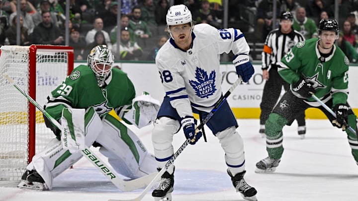 Dec 18, 2024; Dallas, Texas, USA; Dallas Stars goaltender Jake Oettinger (29) and Toronto Maple Leafs right wing William Nylander (88) look for the puck in the Dallas zone during the first period at the American Airlines Center. Mandatory Credit: Jerome Miron-Imagn Images