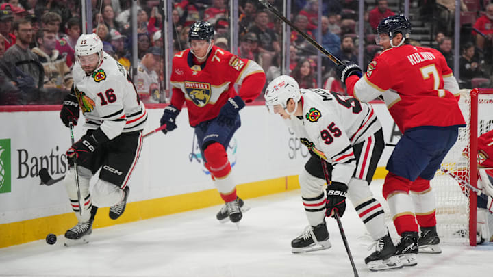 Feb 1, 2025; Sunrise, Florida, USA;  Chicago Blackhawks center Jason Dickinson (16) looks to keep the puck in the Florida Panthers zone in the first period at Amerant Bank Arena. Mandatory Credit: Jim Rassol-Imagn Images