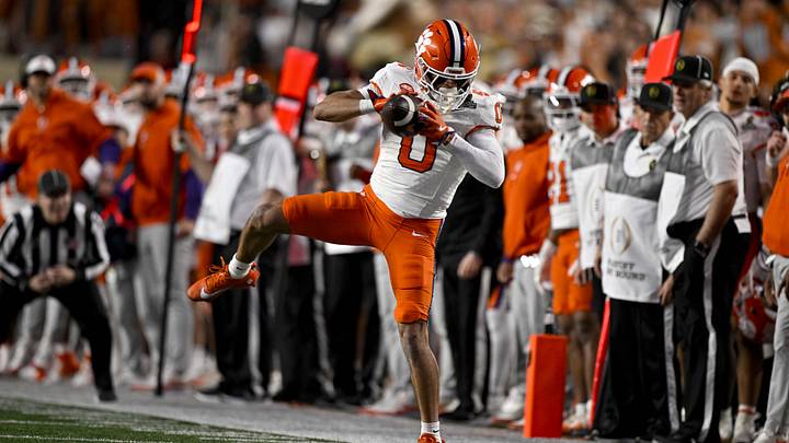 Dec 21, 2024; Austin, Texas, USA; Clemson Tigers wide receiver Antonio Williams (0) makes a catch for a first down against the Texas Longhorns during the second half of the CFP National Playoff first round game at Darrell K Royal-Texas Memorial Stadium. Mandatory Credit: Jerome Miron-Imagn Images Dec 21, 2024; Austin, Texas, USA; Clemson Tigers wide receiver Antonio Williams (0) makes a catch for a first down against the Texas Longhorns during the second half of the CFP National Playoff first round game at Darrell K Royal-Texas Memorial Stadium. Mandatory Credit: Jerome Miron-Imagn Images