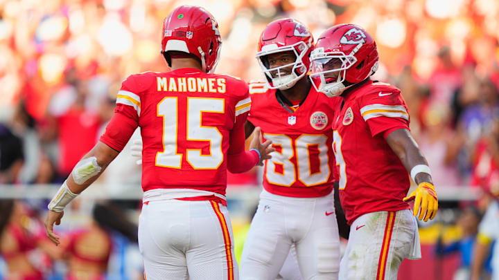 Sep 28, 2025; Kansas City, Missouri, USA;  Kansas City Chiefs wide receiver Tyquan Thornton (80) celebrates with Kansas City Chiefs quarterback Patrick Mahomes (15) and Kansas City Chiefs wide receiver JuJu Smith-Schuster (9) after scoring a touchdown during the third quarter at GEHA Field at Arrowhead Stadium. Mandatory Credit: Jay Biggerstaff-Imagn Images