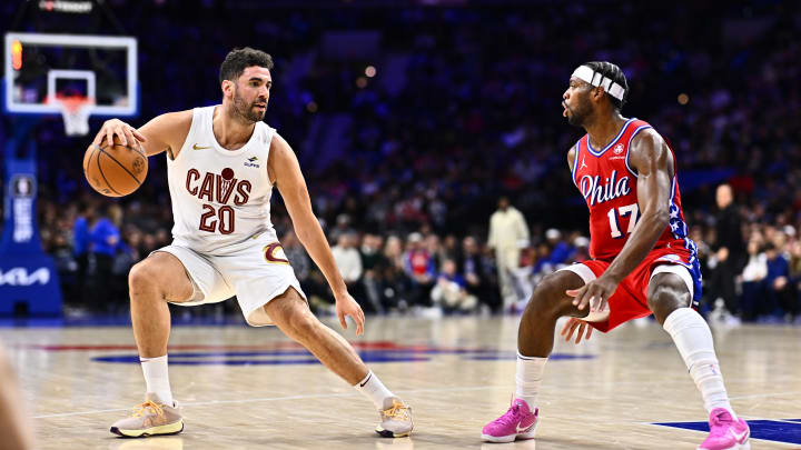 Feb 23, 2024; Philadelphia, Pennsylvania, USA; Cleveland Cavaliers forward Georges Niang (20) controls the ball against Philadelphia 76ers guard Buddy Hield (17) in the second quarter at Wells Fargo Center. Mandatory Credit: Kyle Ross-USA TODAY Sports
