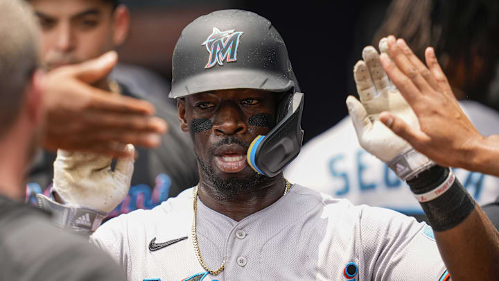 Jul 2, 2023; Cumberland, Georgia, USA; Miami Marlins center fielder Jonathan Davis (49) gets high