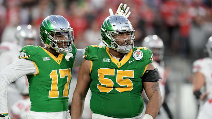 Jan 1, 2025; Pasadena, CA, USA; Oregon Ducks defensive lineman Derrick Harmon (55) reacts in the second half against the Ohio State Buckeyes in the 2025 Rose Bowl college football quarterfinal game at Rose Bowl Stadium. Mandatory Credit: Kirby Lee-Imagn Images Jan 1, 2025; Pasadena, CA, USA; Oregon Ducks defensive lineman Derrick Harmon (55) reacts in the second half against the Ohio State Buckeyes in the 2025 Rose Bowl college football quarterfinal game at Rose Bowl Stadium. Mandatory Credit: Kirby Lee-Imagn Images