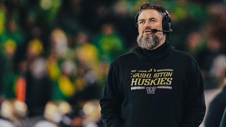 Brennan Carroll works from the sideline during the UW-Oregon football game. 