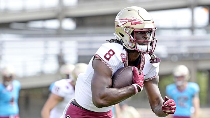 Apr 20, 2024; Tallahassee, Florida, USA; Florida State Seminoles wide receiver Hykeem Williams (8) runs the ball during the Spring Showcase at Doak S. Campbell Stadium. Mandatory Credit: Melina Myers-Imagn Images