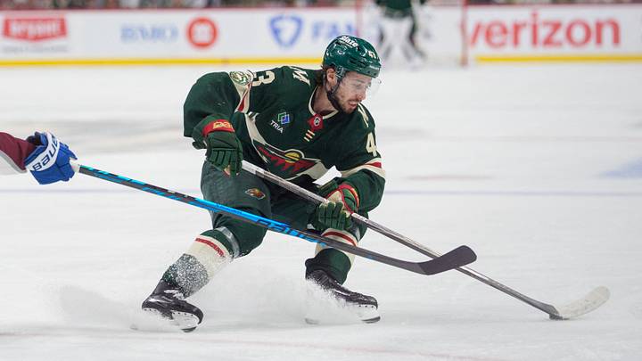 May 9, 2026; Saint Paul, Minnesota, USA; Minnesota Wild defenseman Quinn Hughes (43) spins away from the defense of Colorado Avalanche center Jack Drury (18) in the second period of game three of the second round of the 2026 Stanley Cup Playoffs at Grand Casino Arena. Mandatory Credit: Matt Blewett-Imagn Images