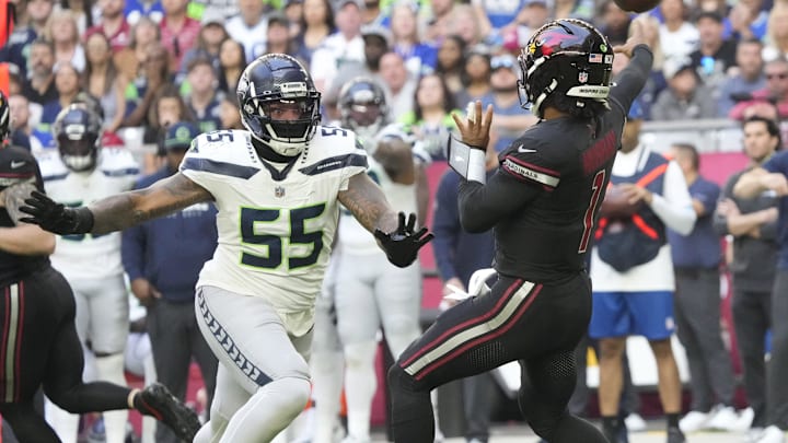 Arizona Cardinals quarterback Kyler Murray (1) throws while pressured by Seattle Seahawks defensive end Dre'Mont Jones (55) during the first quarter at State Farm Stadium in Glendale on Dec. 8, 2024. Arizona Cardinals quarterback Kyler Murray (1) throws while pressured by Seattle Seahawks defensive end Dre'Mont Jones (55) during the first quarter at State Farm Stadium in Glendale on Dec. 8, 2024.