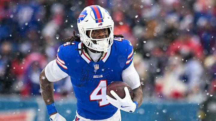 Dec 7, 2025; Orchard Park, New York, USA; Buffalo Bills running back James Cook III (4) carries the ball against the Cincinnati Bengals in the third quarter at Highmark Stadium. Mandatory Credit: Mark Konezny-Imagn Images
