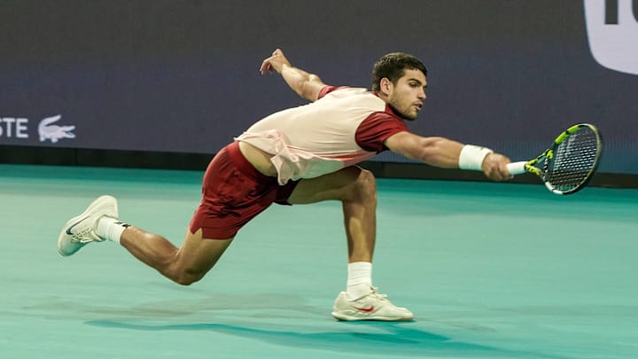 Carlos Alcaraz (ESP) returns a shot to David Goffin (not pictured) during the mens singles second round at the 2025 Miami Open presented by Itau at Hard Rock Stadium. 