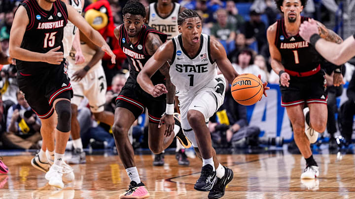 Michigan State guard Jeremy Fears Jr. (1) dribbles against Louisville guard Kobe Rodgers (11) during the second half of NCAA Tournament Second Round at KeyBank Center in Buffalo on Saturday, March 21, 2026. Michigan State guard Jeremy Fears Jr. (1) dribbles against Louisville guard Kobe Rodgers (11) during the second half of NCAA Tournament Second Round at KeyBank Center in Buffalo on Saturday, March 21, 2026.