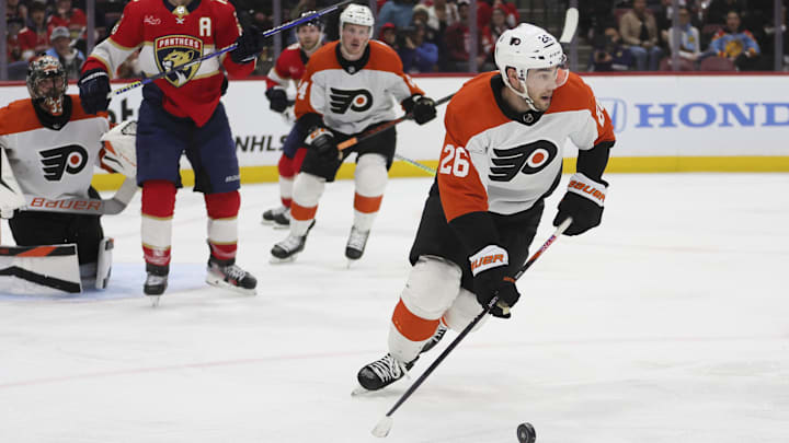 Feb 6, 2024; Sunrise, Florida, USA; Philadelphia Flyers defenseman Sean Walker (26) moves the puck