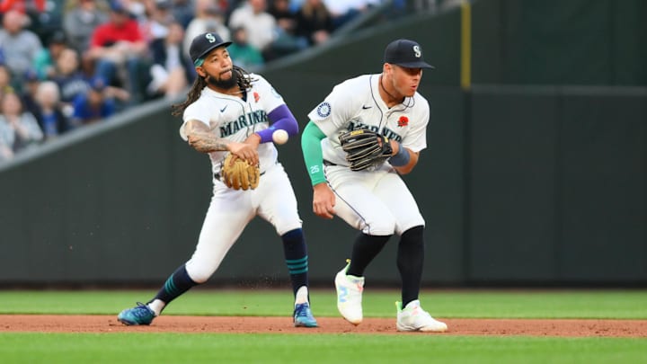 May 27, 2024; Seattle, Washington, USA; Seattle Mariners shortstop J.P. Crawford (3) throws the ball past third baseman Dylan Moore (25) for a force out against the Houston Astros during the sixth inning at T-Mobile Park. Mandatory Credit: Steven Bisig-USA TODAY Sports May 27, 2024; Seattle, Washington, USA; Seattle Mariners shortstop J.P. Crawford (3) throws the ball past third baseman Dylan Moore (25) for a force out against the Houston Astros during the sixth inning at T-Mobile Park. Mandatory Credit: Steven Bisig-USA TODAY Sports